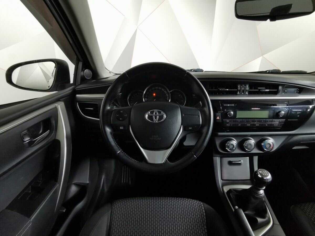 Toyota Corolla 2013 года с пробегом. Фото: #14